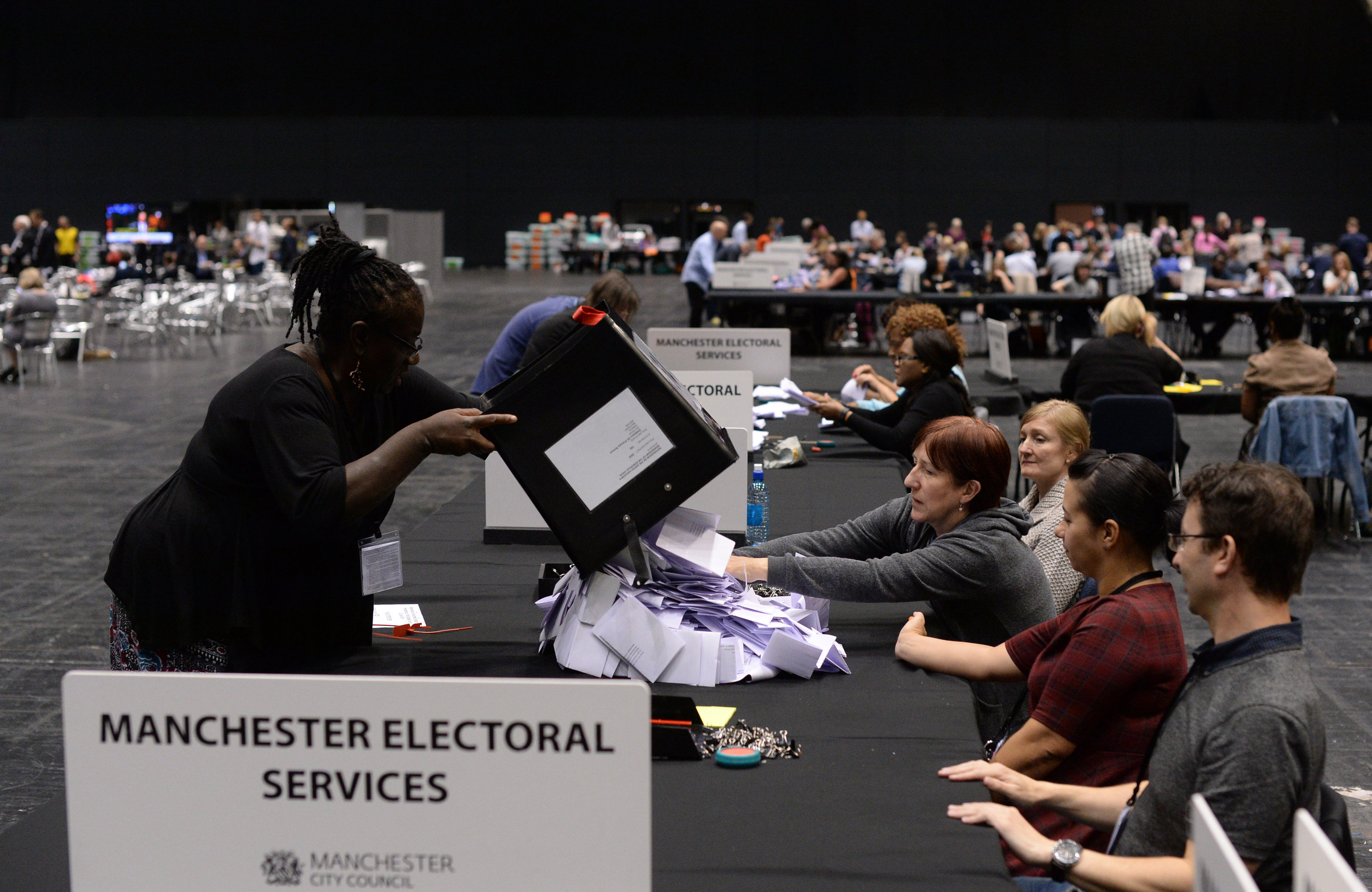 Election workers in the United Kingdom counting ballots following the country's vote on EU membership, June 24, 2015 Election workers in the United Kingdom counting ballots following the country's vote on EU membership, June 24, 2015